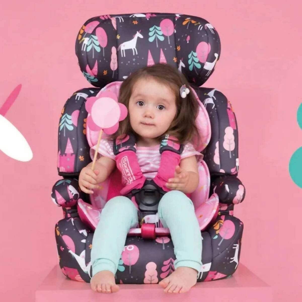 Group 1-3 car seat with child seated, dark vehicle-print cover and headrest