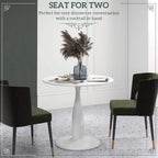 White round dining table with tapered pedestal base for compact seating
