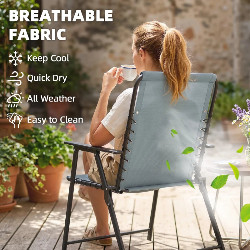 Light grey high-back folding garden chair with armrests on patio, breathable outdoor fabric