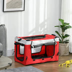 Red pet dog stroller crate with black mesh panels and padded base indoors on floor