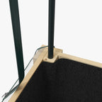 Corner of raised planter box greenhouse frame with black fabric bed liner