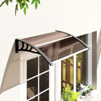 Brown arched door canopy awning installed above a glass door with black support brackets