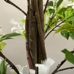 Close-up of artificial honeysuckle trunk with branch tips and white blossoms