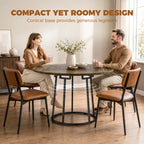Compact round dining table with rustic woodgrain top and black conical metal base