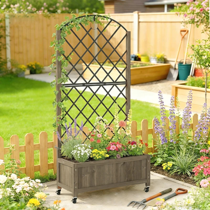 Raised wooden planter bed with black metal trellis, blooming flowers, and caster wheels