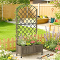 Raised wooden planter bed with black metal trellis, blooming flowers, and caster wheels