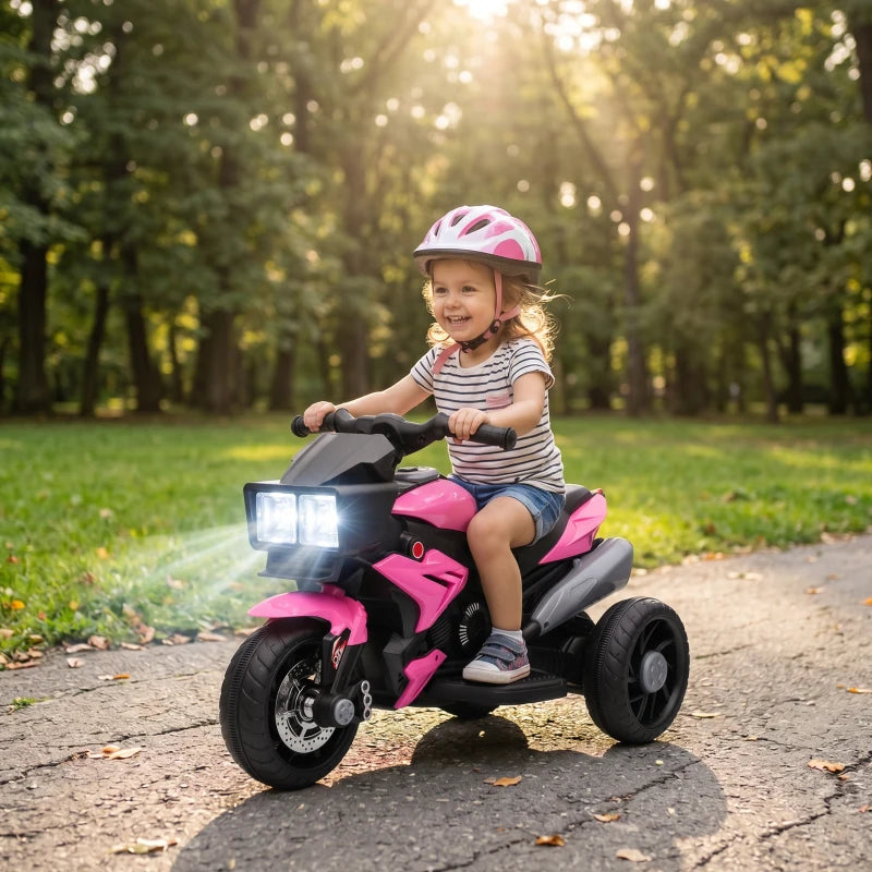 Pink and black 3-wheel ride-on motorcycle toy with child riding and front LED headlight.