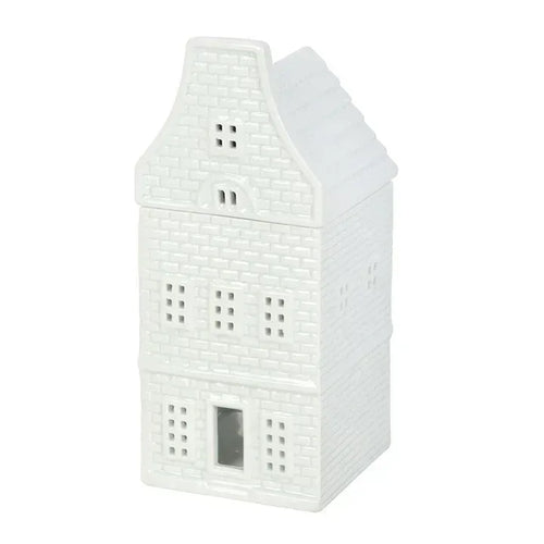 White ceramic house-shaped wax warmer with chimney and front window opening