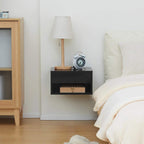 High-gloss black floating bedside table with open shelf and alarm clock