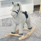 Grey plush rocking horse with navy saddle on wooden rocking base, standing side view