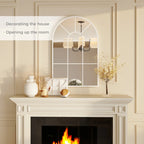 White arched grid mirror above fireplace with window-style pane grid