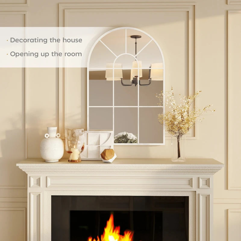 White arched grid mirror above fireplace with window-style pane grid