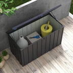 Dark grey galvanized steel garden storage box with lid open, holding tools and bottle.