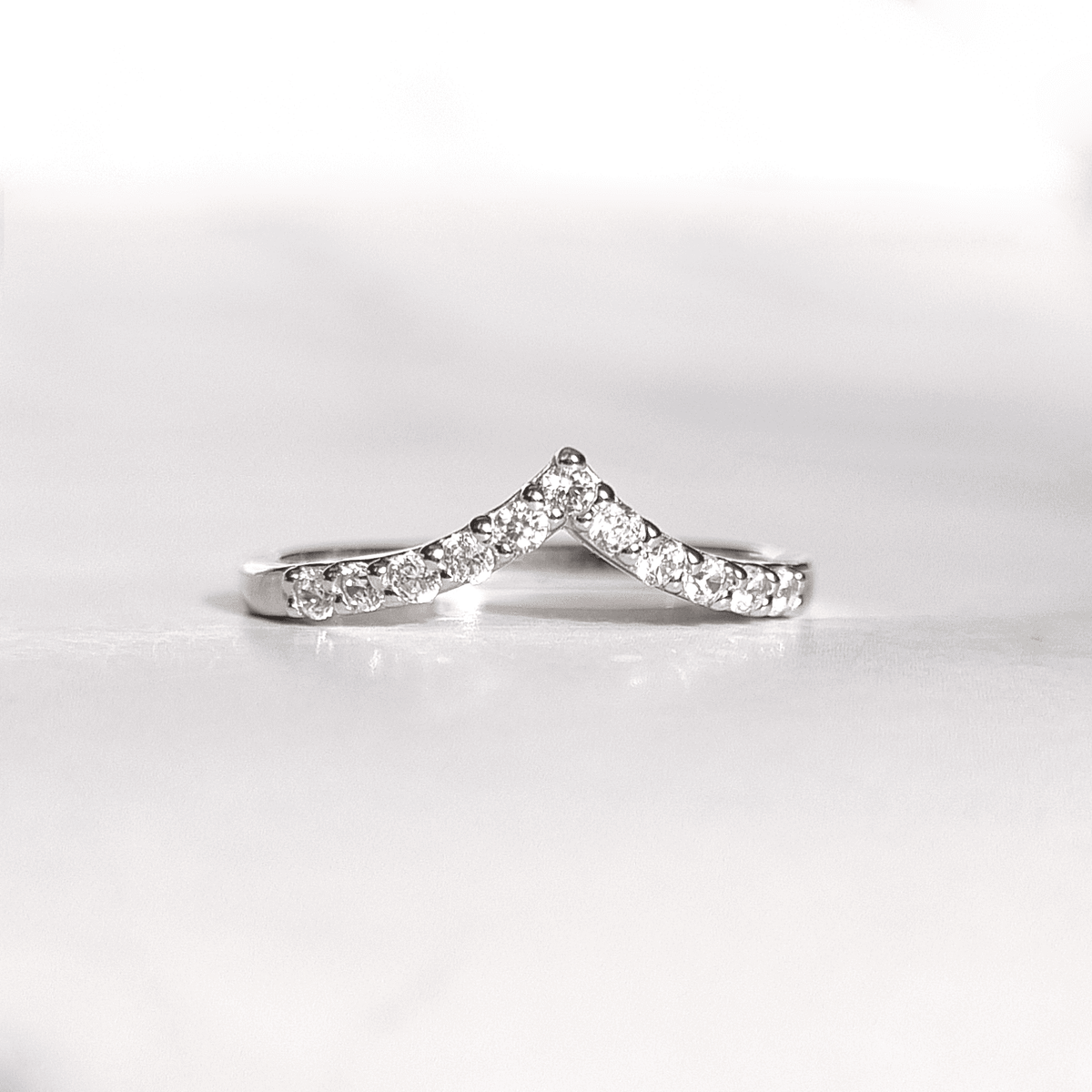 Sterling silver wishbone eternity ring with curved pavé-set stones