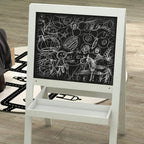 White double-sided easel with chalkboard writing surface and storage tray