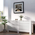 White radiator cover with top shelf and horizontal slat front panels for venting.