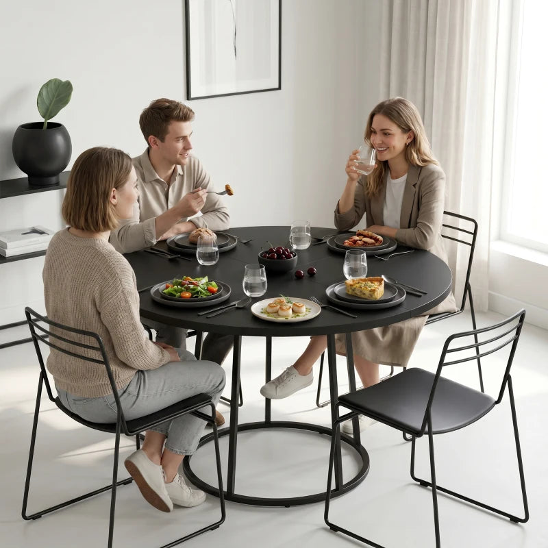 Round black dining table with conical metal base, compact circular design