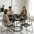 Round black dining table with conical metal base, compact circular design