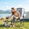 Light grey padded camping chair with side pocket panel and cup holder on armrest