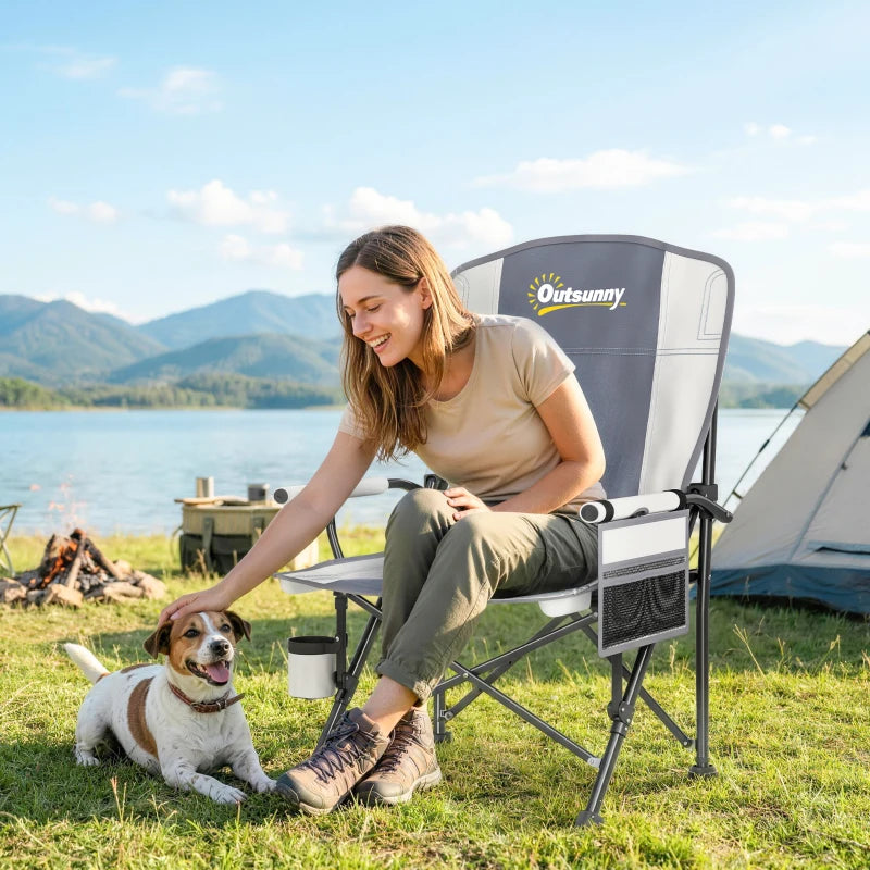 Light grey padded camping chair with side pocket panel and cup holder on armrest
