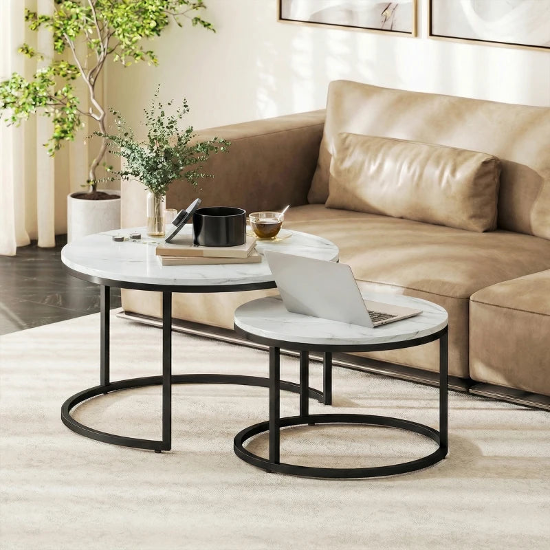 Two round nesting tables with white marble-effect tops and black metal frames
