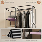 Pink fabric wardrobe frame with hanging rail and shelves, sturdy metal support poles.