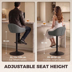 Grey bar stool with padded seat, curved backrest, and armrests on adjustable base