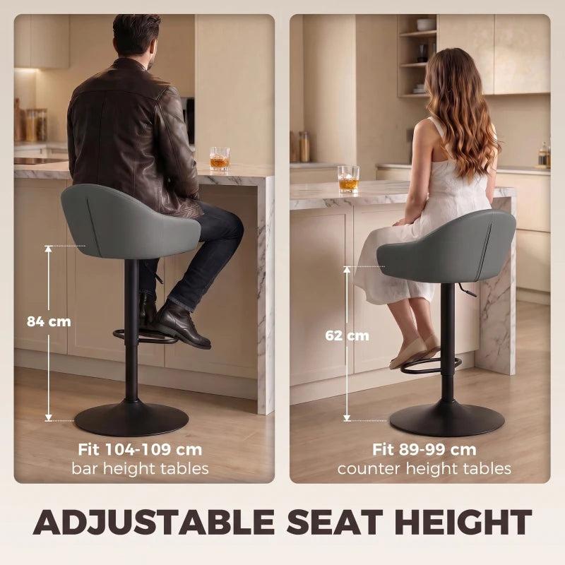 Grey bar stool with padded seat, curved backrest, and armrests on adjustable base