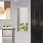 Gold-tone grid wall mirror with rectangular frame and reflective glass panels.