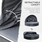 Retractable canopy on black round outdoor daybed with gray cushions