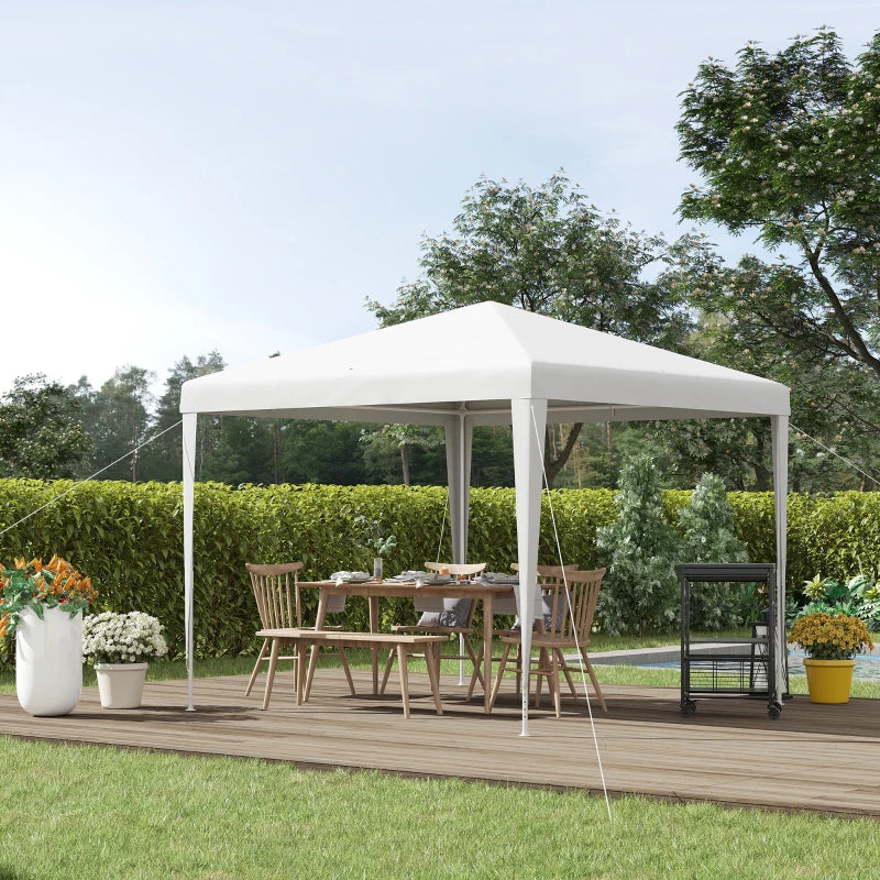 White outdoor gazebo canopy tent with open sides, set up on a wooden deck