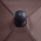 Brown parasol canopy with round dark finial on rib joint