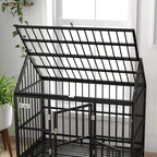 Black metal dog crate with raised top frame and front latch hardware