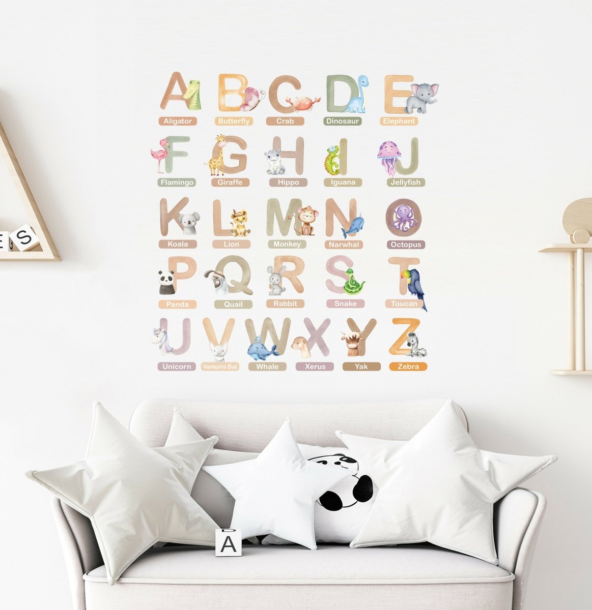 Animal alphabet wall stickers on wall above sofa, colorful A–Z letters with animals