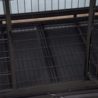 Black metal dog crate interior with grated floor panel and side door frame