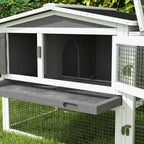 Grey wooden rabbit hutch house with open front compartment, black base, and side wire mesh
