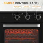 Control panel of black mini convection oven with three knobs and warm interior window