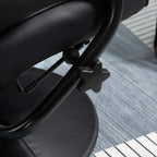 Black faux leather recliner with adjustable lever and round base close-up.