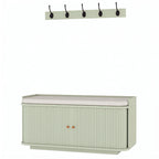 Light green hallway storage bench with cushioned top and wall coat hooks
