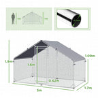 Galvanized walk-in chicken coop with dark gray roof cover and mesh side walls