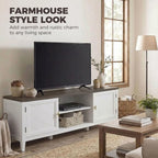 White farmhouse TV console with dark top, open shelves and two cabinet doors.