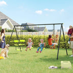 Green metal swing set frame with double swing seats and glider, hanging from ropes.