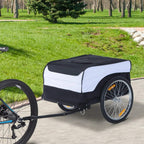 Black-and-white bike cargo trailer with cover and large rear wheel on paved path