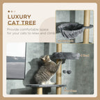 Grey floor-to-ceiling cat tree tower with hammock-style bed and raised perches