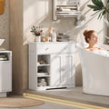 White bathroom floor cabinet with top drawer and double doors over open shelving