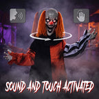 Sound-activated Halloween clown animatronic with glowing red eyes, orange hair, raised hand