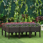 Brown elevated planter bed with woven sides and colorful flowers planted inside