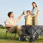 Dark grey folding cargo wagon trailer with telescopic pull handle and oversized all-terrain wheels