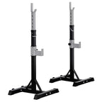 Adjustable barbell squat rack with black base, silver uprights, and J-hook arms.