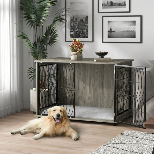 Grey dog crate end table with open front and black wire panels, plush interior cushion